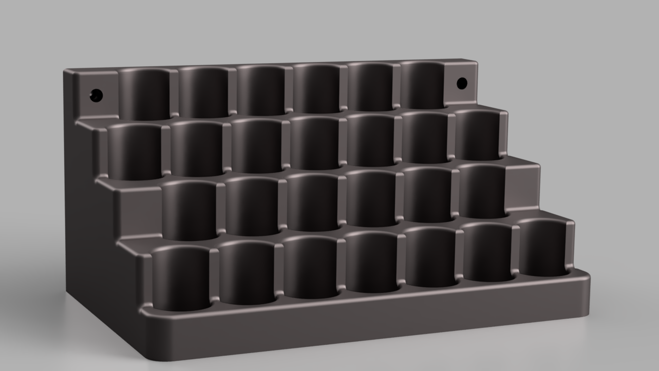 Black plastic component with multiple holes on a gray background