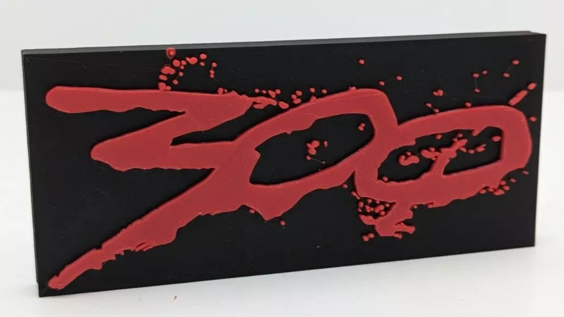 Black rectangular sign with red '300' logo on a white background