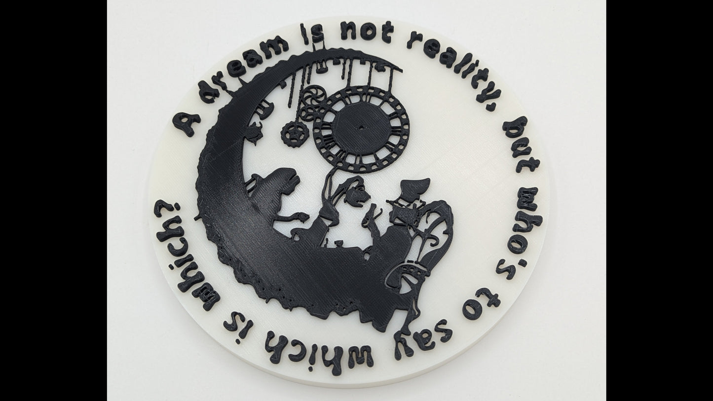Circular decorative item with silhouette of Alice and Wonderland characters and text on a white background