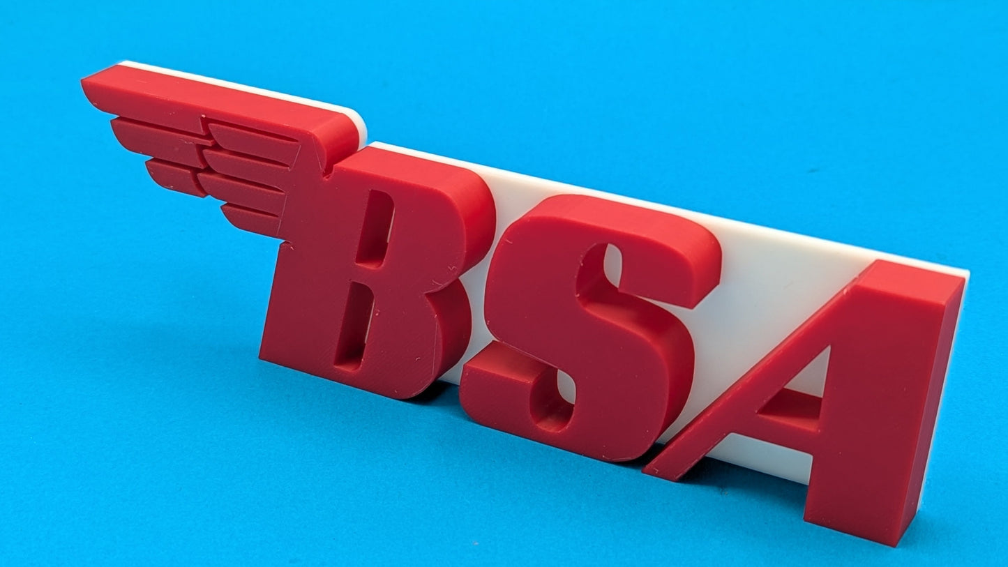 Red 'BSA' logo with wings on a blue background