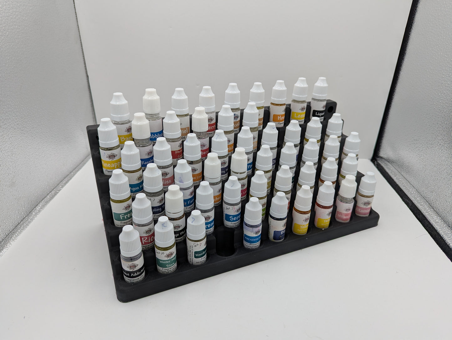 Storage for 10mm dropper bottles. 57 spaces for 21mm dia 70mm tall bottles.