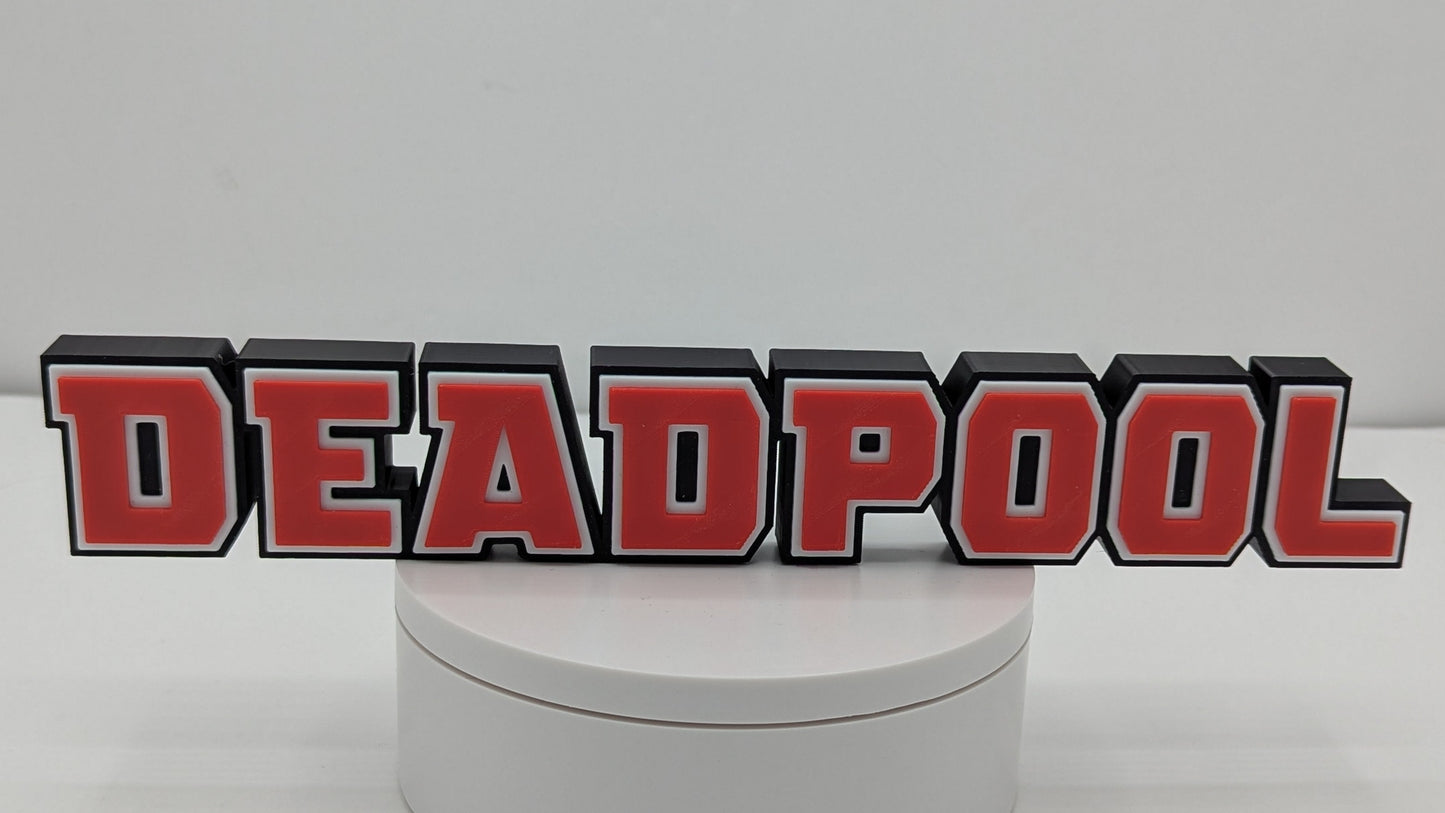 Round white box with 'DEADPOOL' logo on a gray background