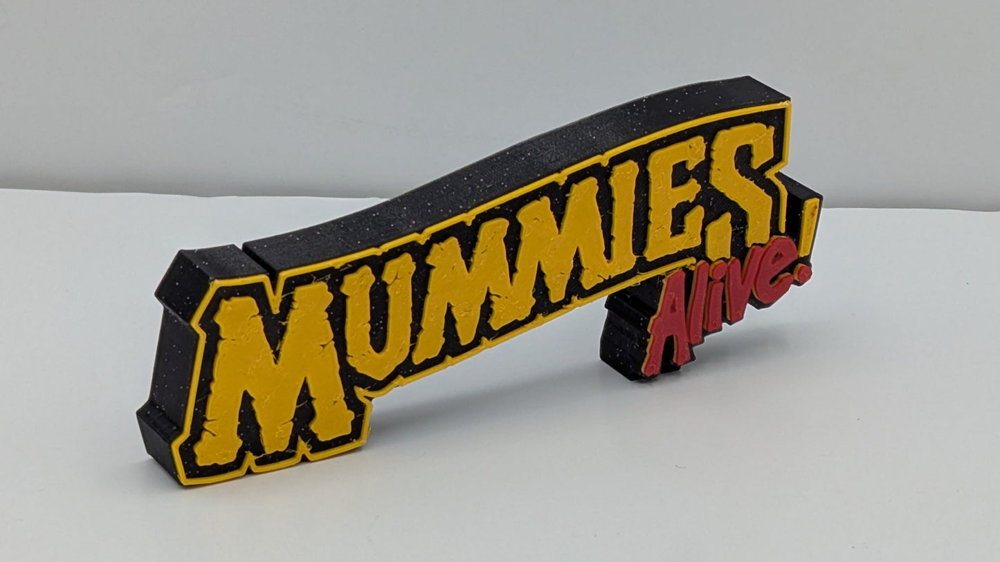 mummies alive logo in gold and red lettering