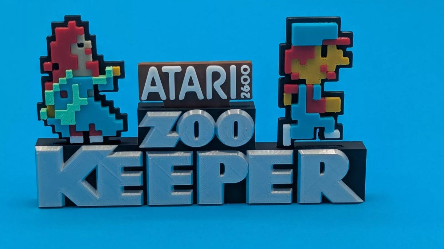 Pixelated characters and 'Atari Zoo Keeper' text on a blue background