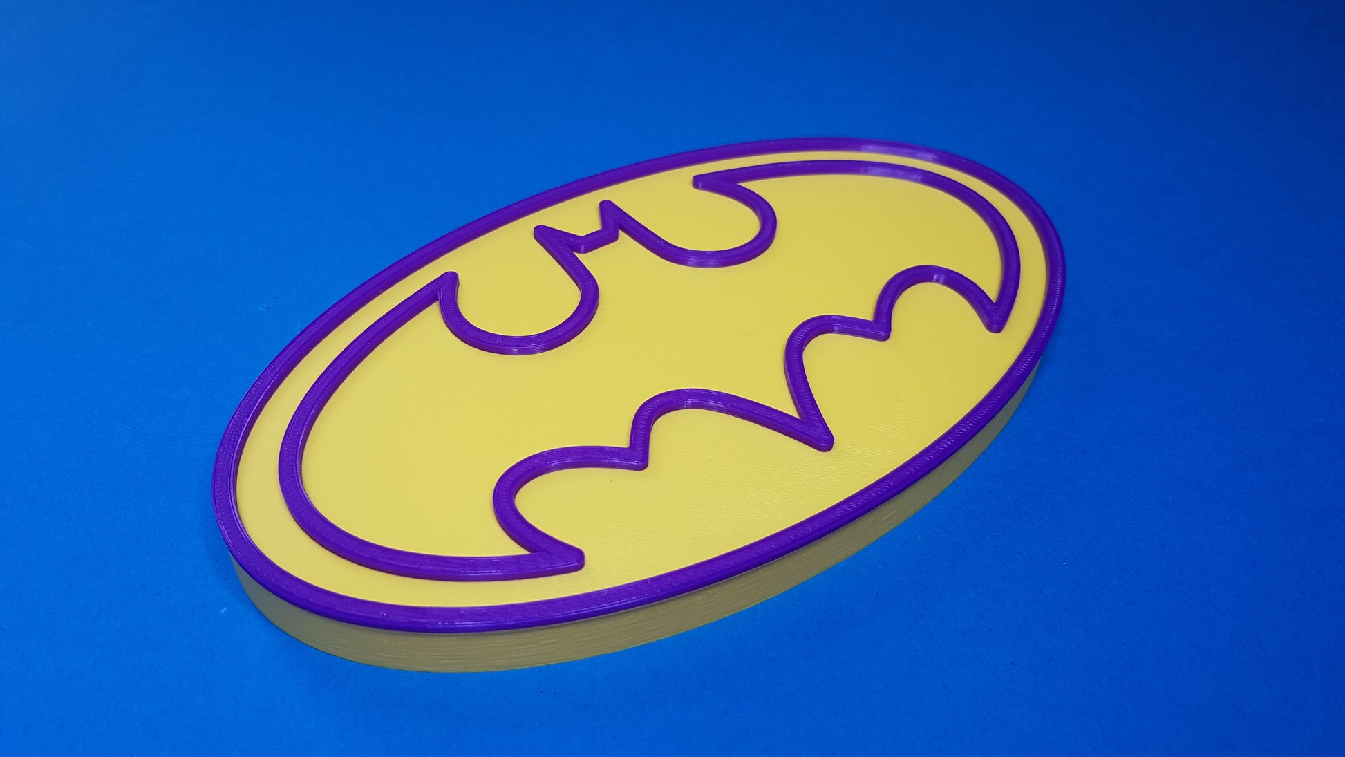 Bat logo on a blue background