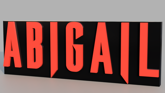 Black sign with red letters spelling 'ABIGAIL' on a gray background
