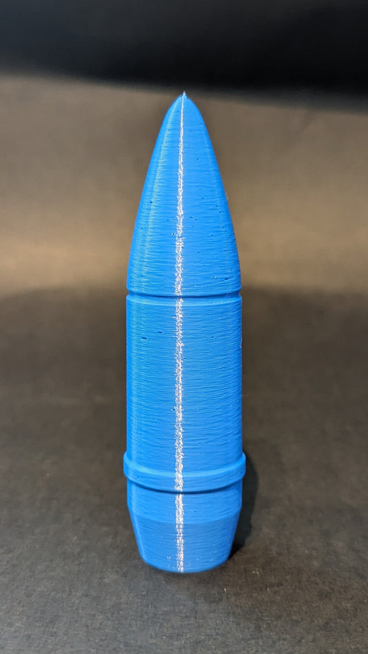 Blue 3D-printed object on a gray surface with a black background