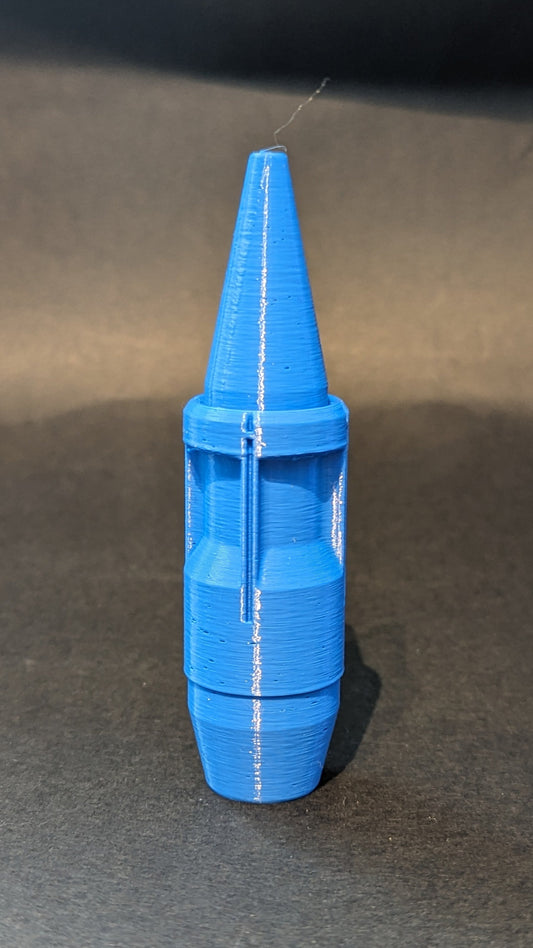 Blue plastic cone-shaped object on a gray surface