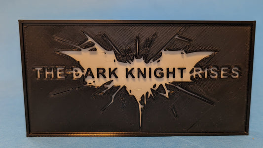 Logo of 'The Dark Knight Rises' on a blue background