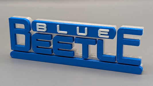 Blue 'Blue Beetle' logo on a gray background