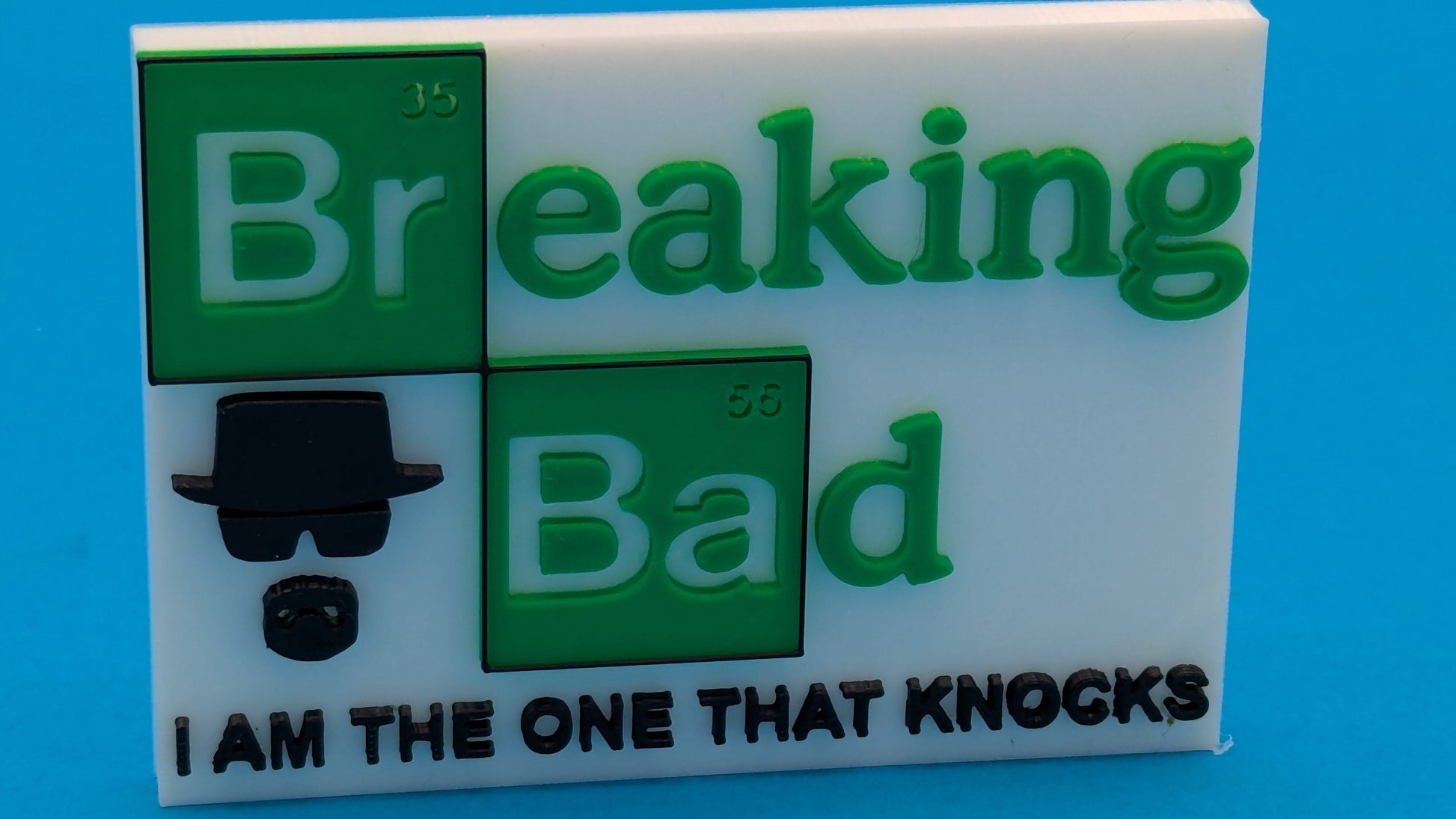 Breaking Bad-themed product with green text and a black silhouette on a blue background