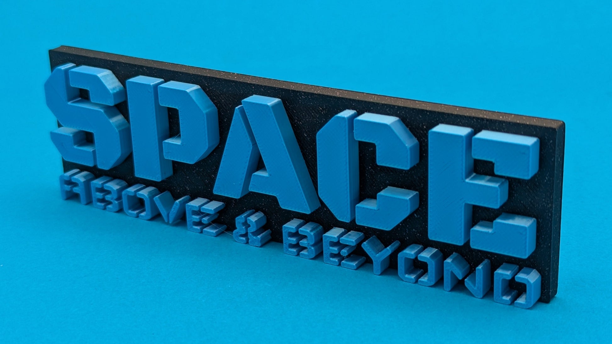 3D metal sign with 'SPACE' text on a blue background