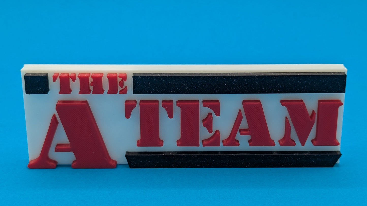 Rectangular object with 'The A Team' text on a blue background