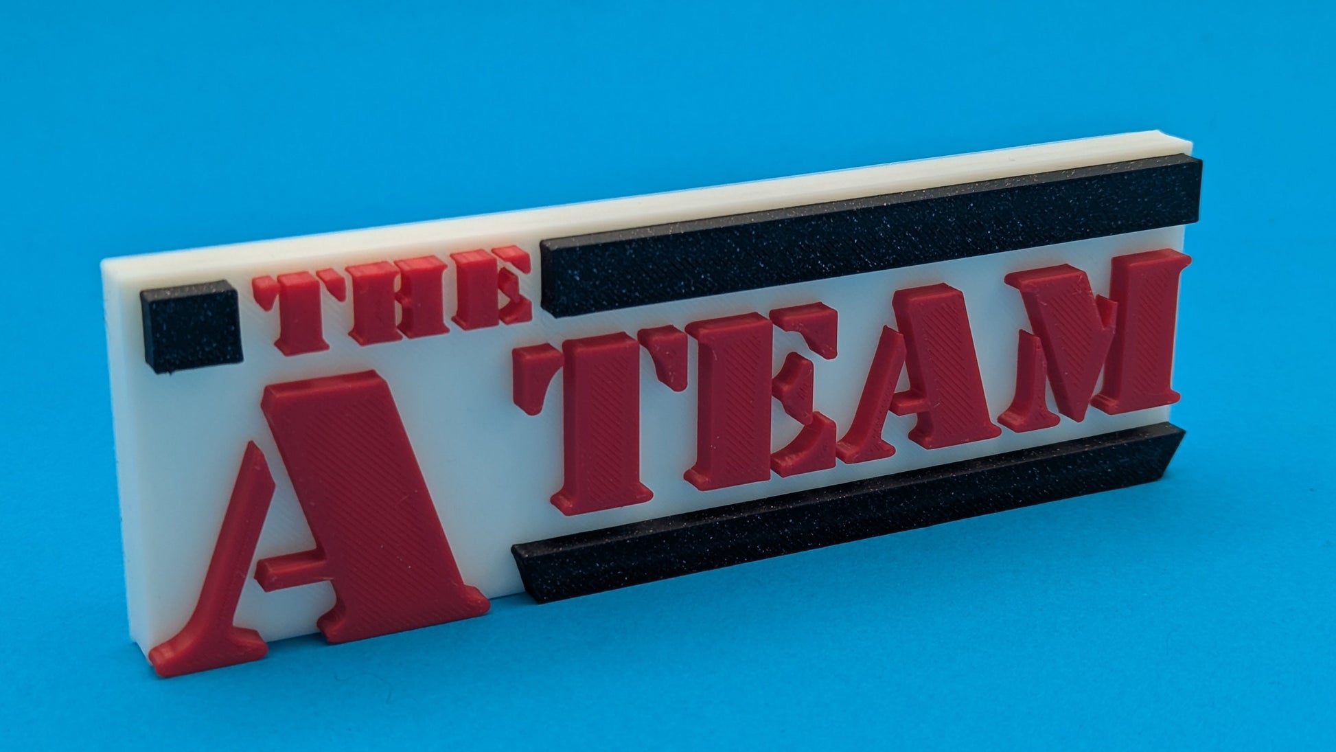 Logo of 'The A Team' on a blue background