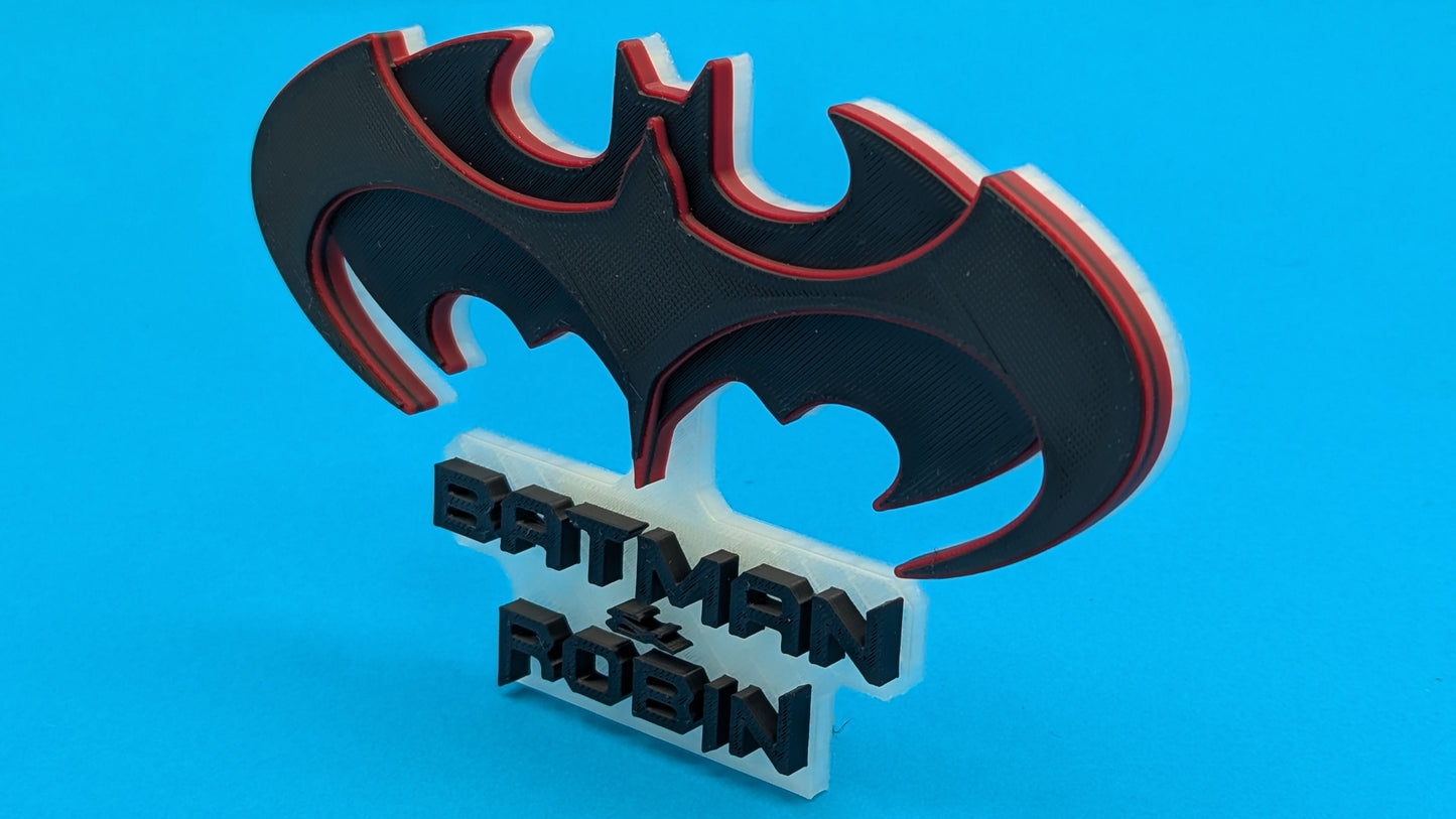 Batman and Robin logo on a blue background