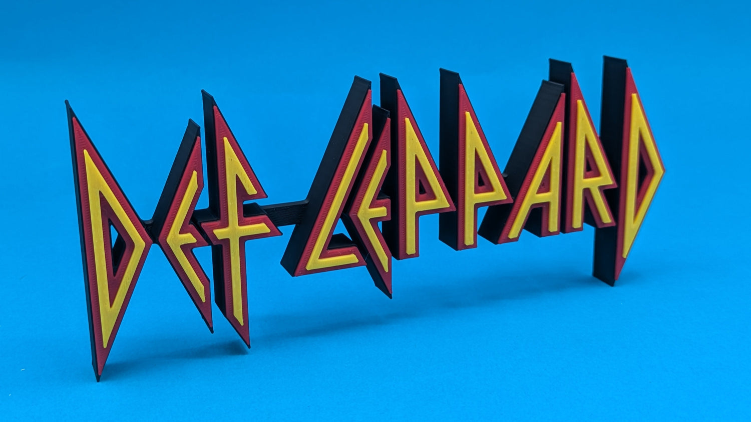 Def Leppard logo on a blue background