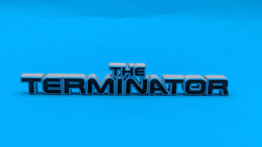 the terminator logo, silver and black