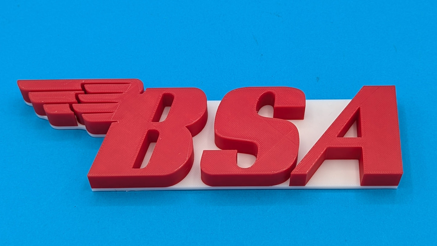 Red 'BSA' logo on a blue background