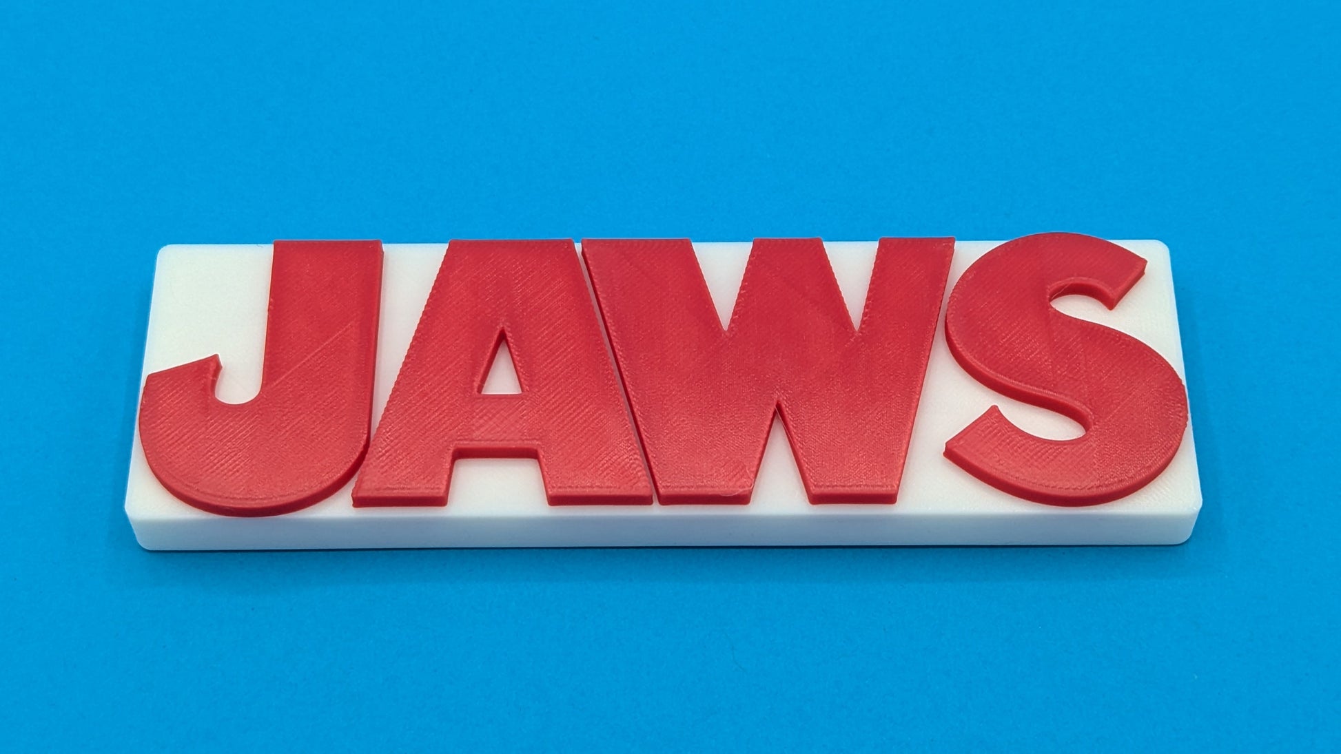 Red 'JAWS' logo on a white background with a blue gradient