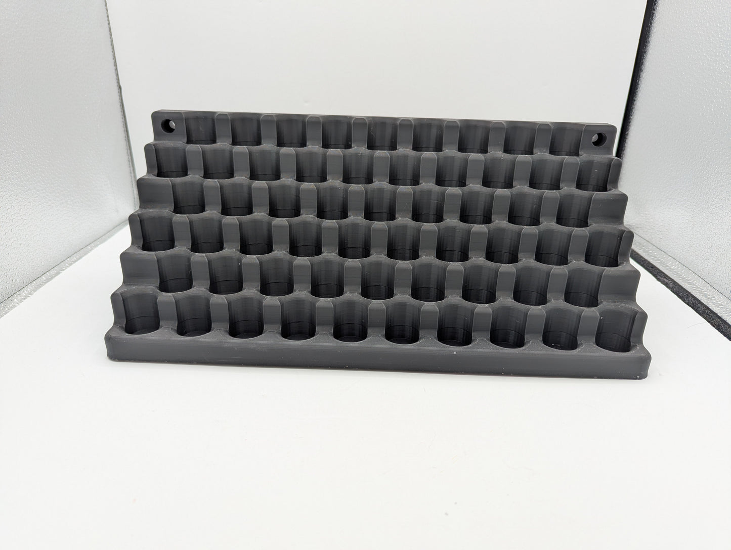 3D Print file - Storage for 10mm dropper bottles. 57 spaces for 21mm dia 70mm tall bottles.