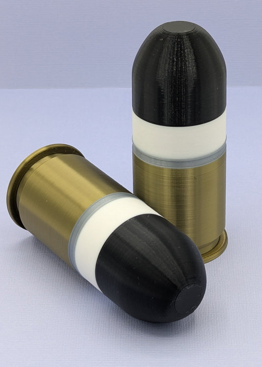 Two bullet casings on a light gray background