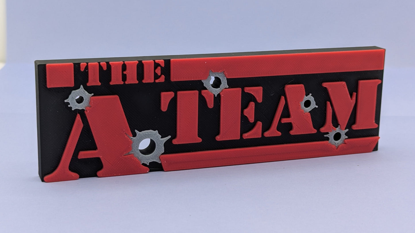 Decorative sign with 'The A Team' text on a red and black background