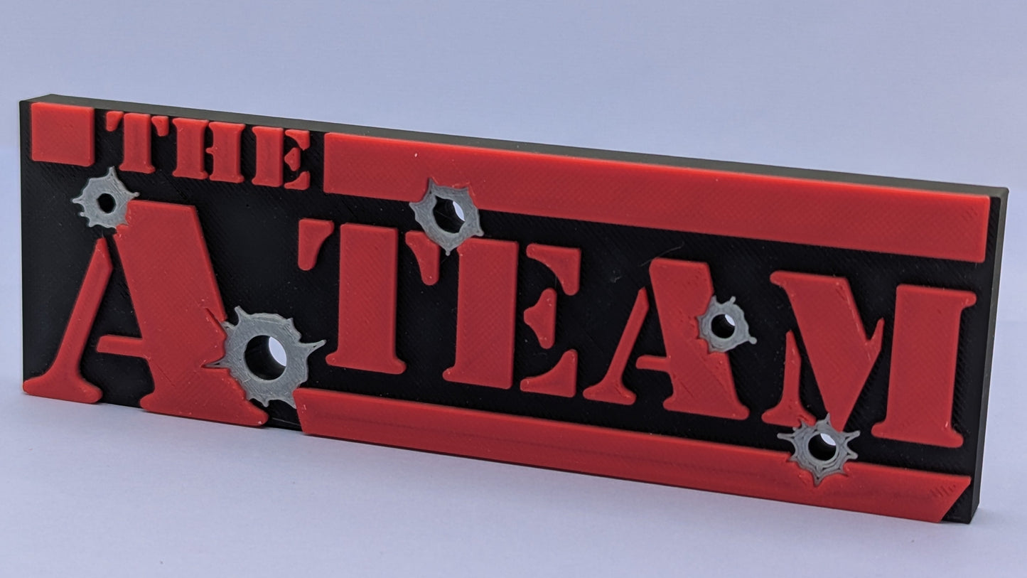 Decorative sign with 'The A Team' text on a red and black background