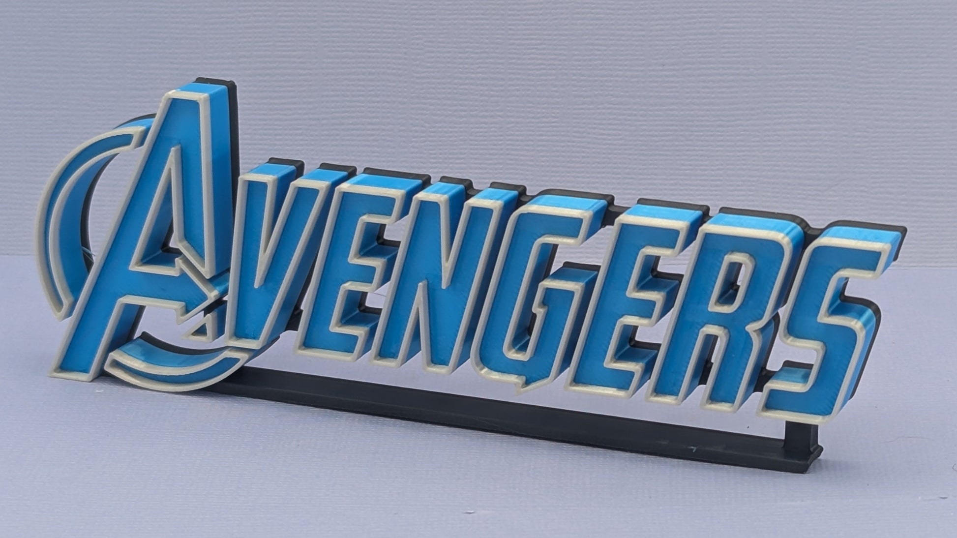 Avengers logo on a gray background