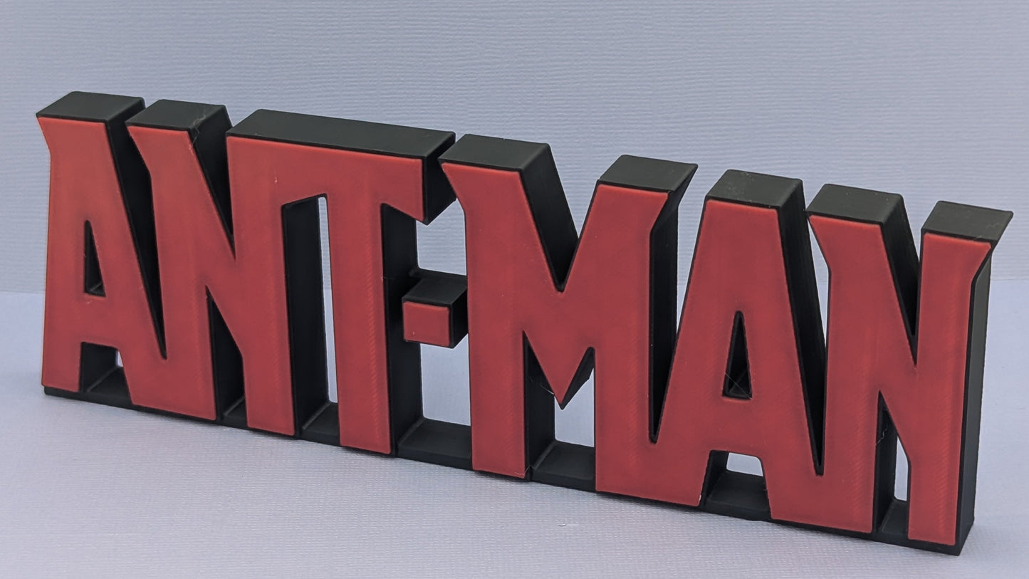 Red and black 'ANT-MAN' logo on a light gray background