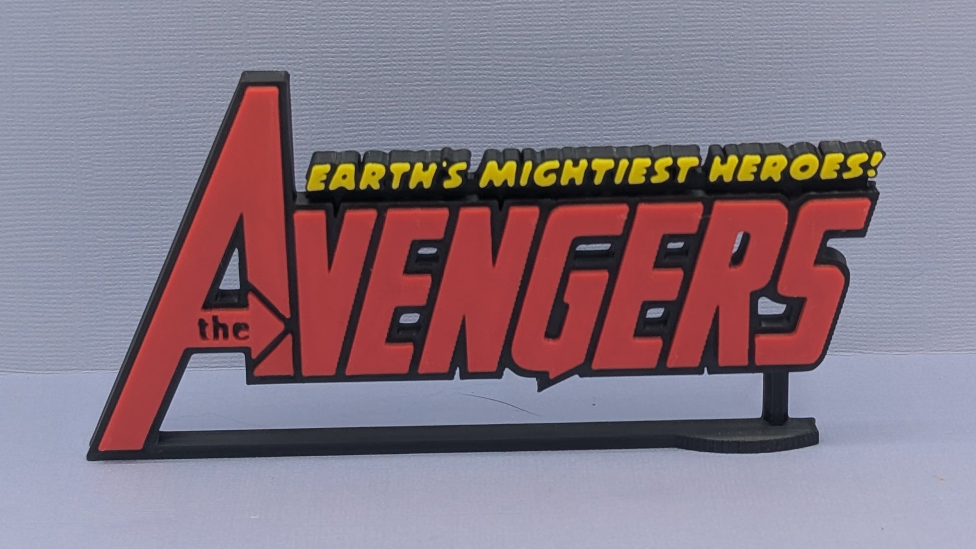 Avengers logo on a gray background