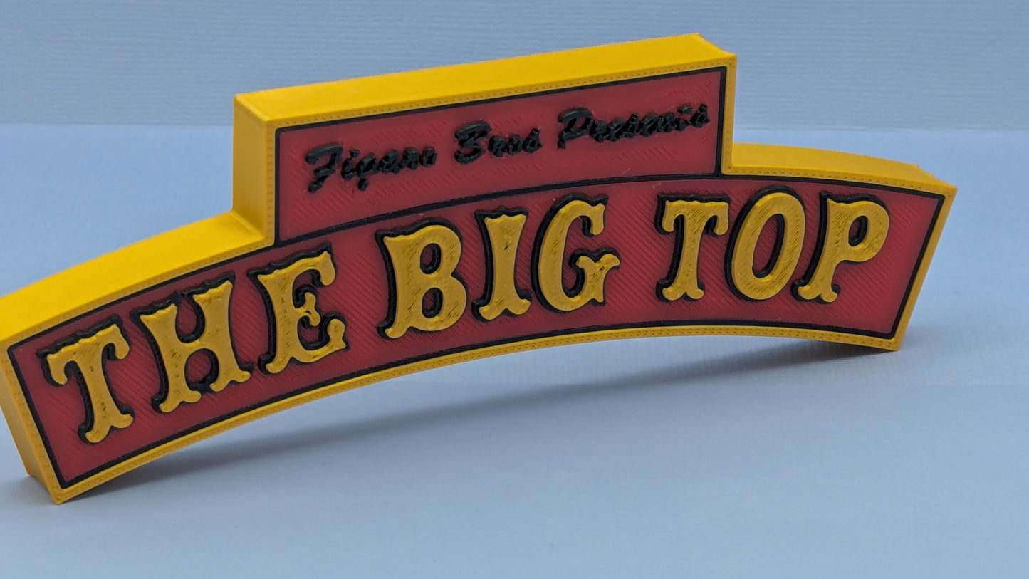 Red and yellow sign with 'The Big Top' on a blue background