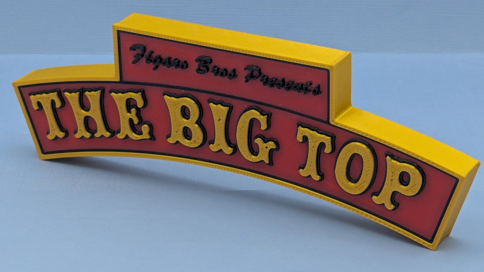 3D model of a sign with 'The Big Top' text on a light blue background