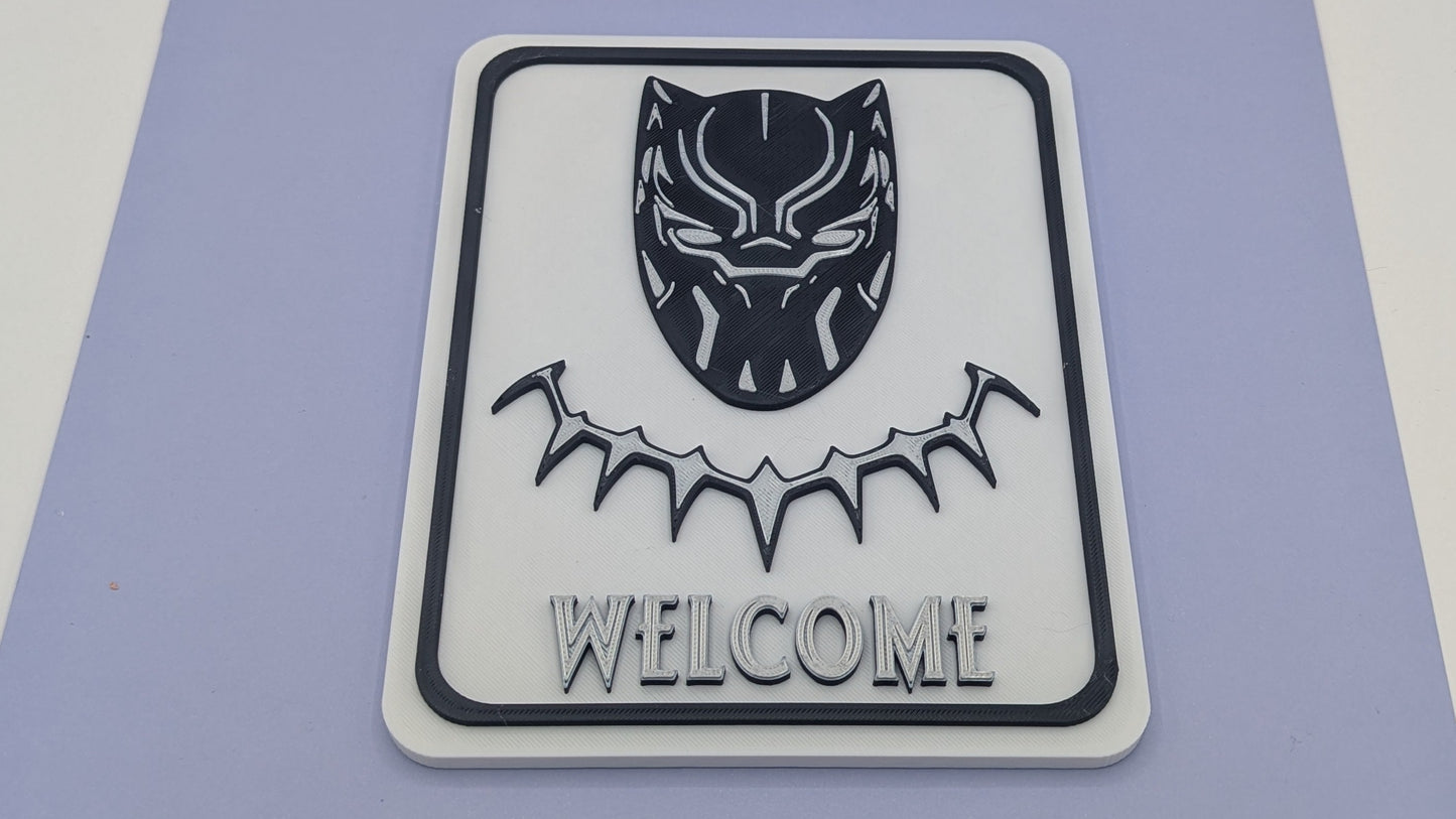 Black Panther welcome sign on a purple mat