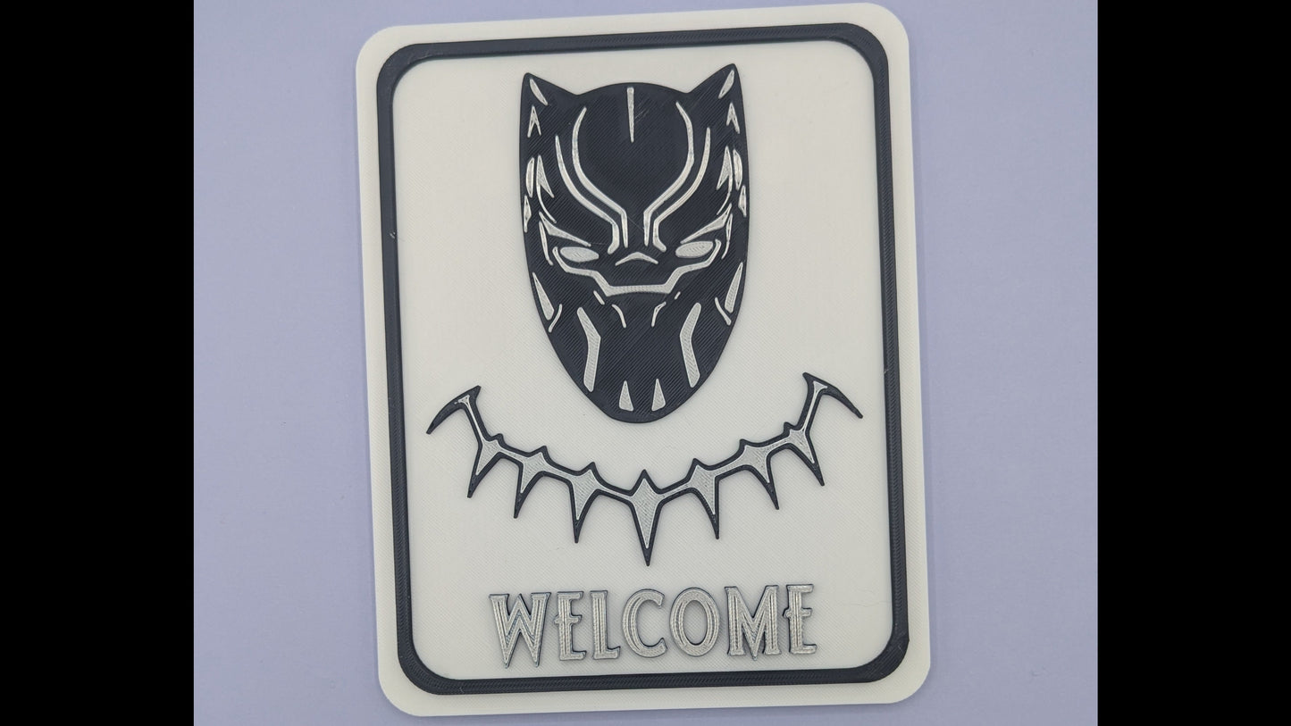 Black Panther welcome sign on a light purple background