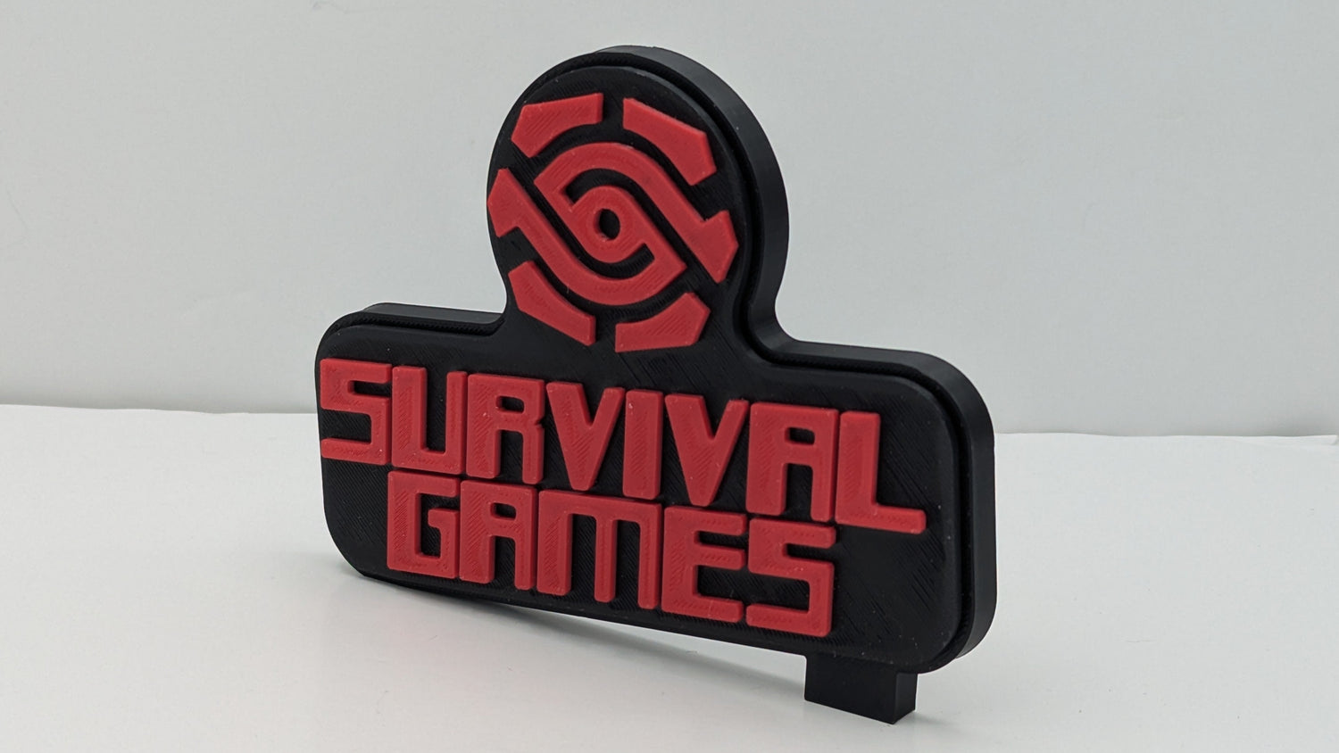 Black and red 'Survival Games' logo on a white background