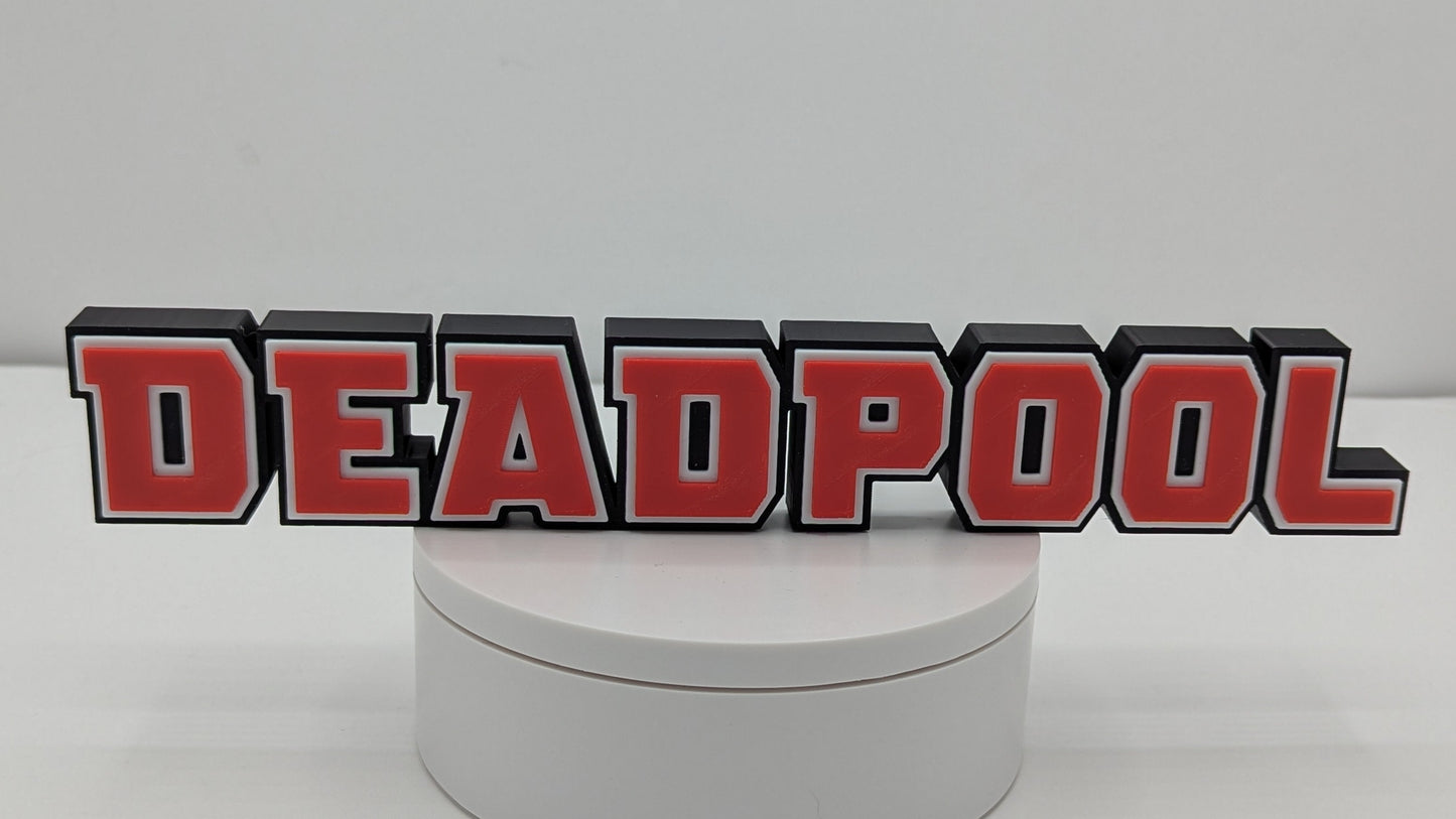 Round white box with 'DEADPOOL' logo on a gray background