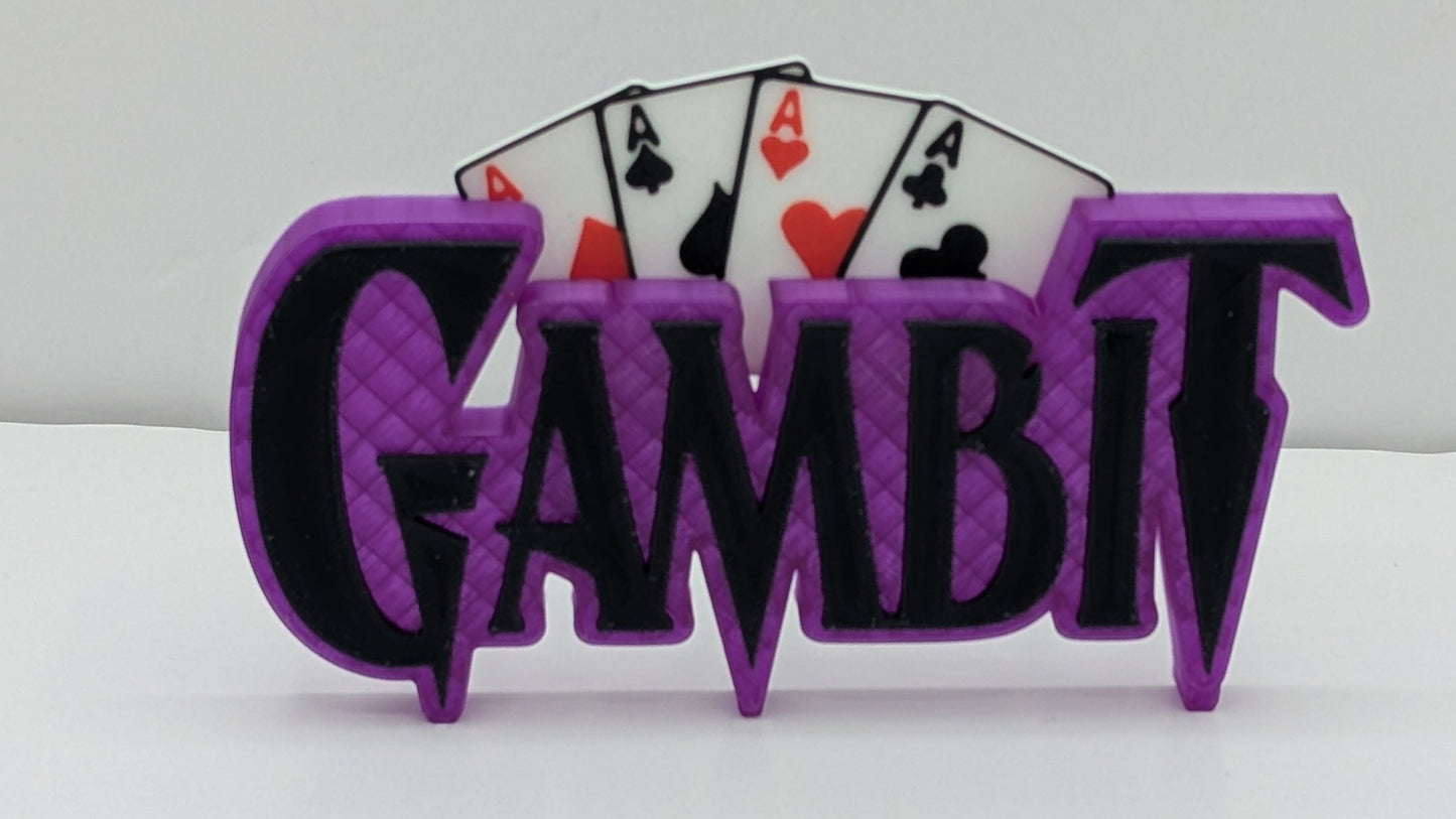 Purple 'Gambit' sign with playing card symbols on a white background