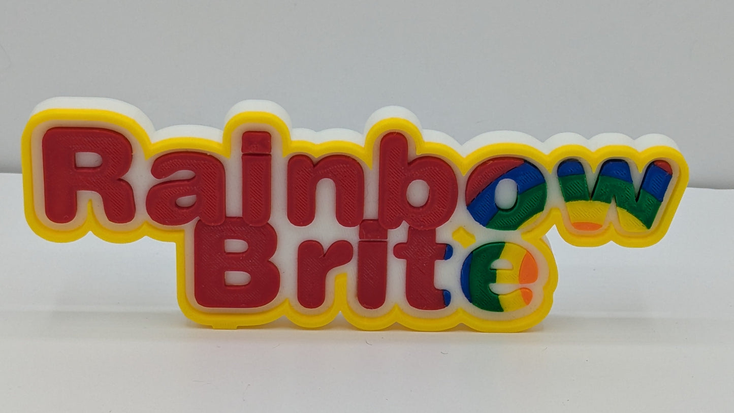 3d printed art piece with "rainbow Brite" in multicolour lettering. 