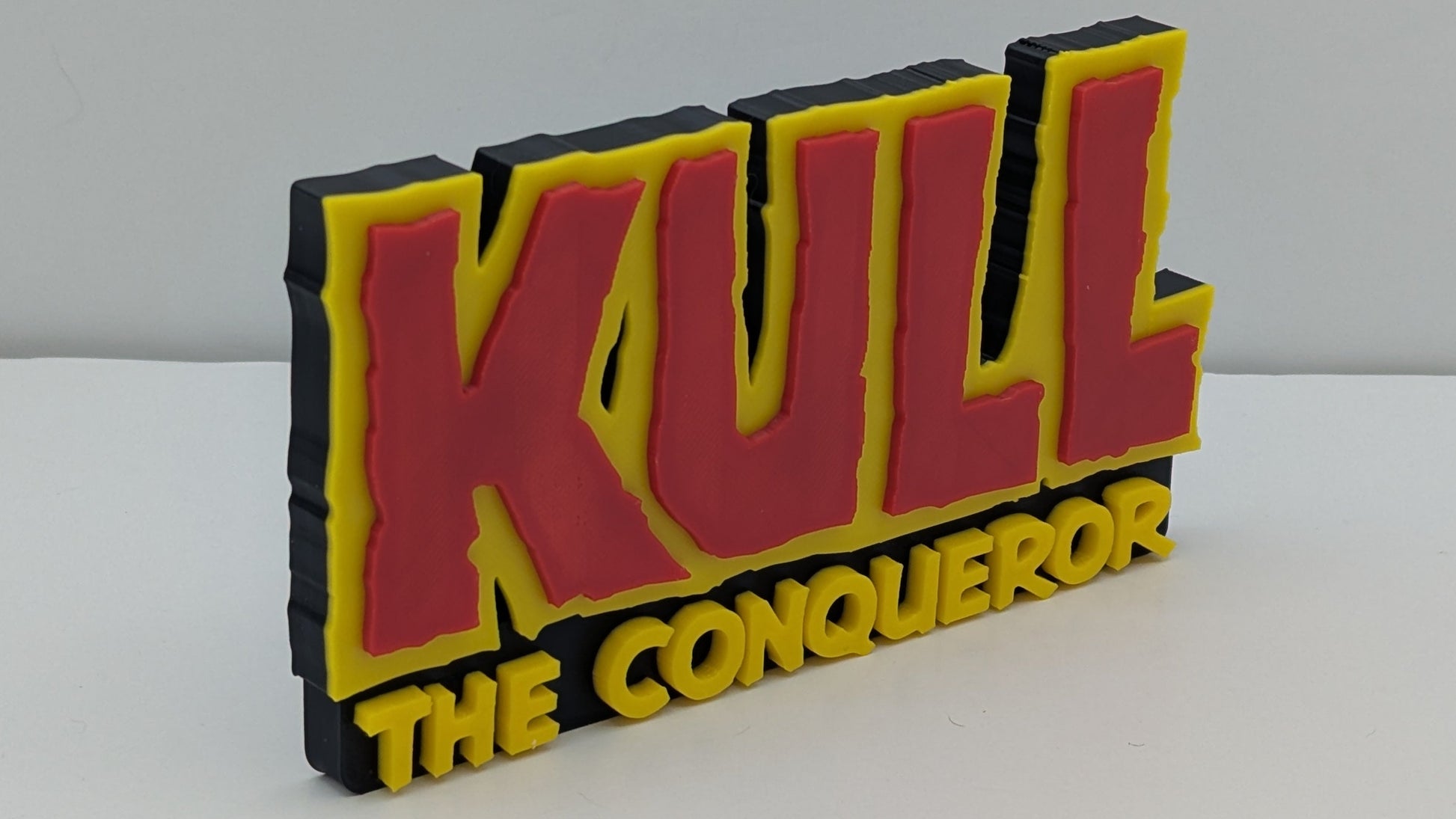 Kull the conquerer on red and yellow on a black background