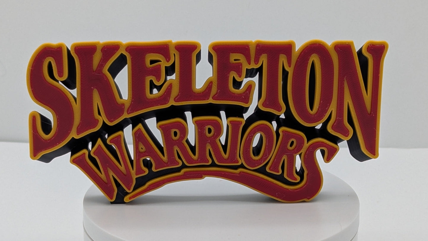Decorative sign with 'Skeleton Warriors' text on a white base