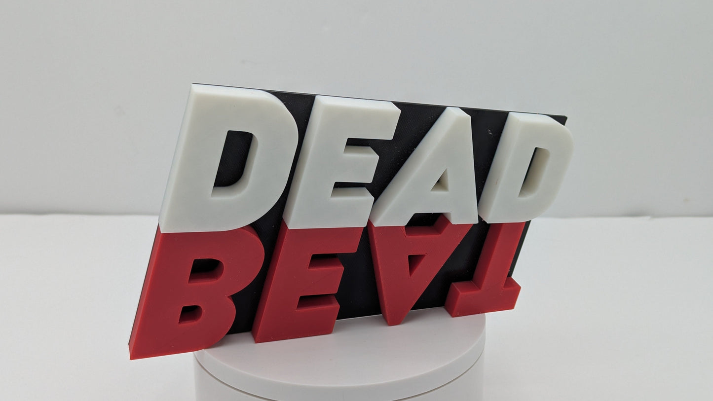 3D text sculpture spelling 'DEAD BEAT' on a white background