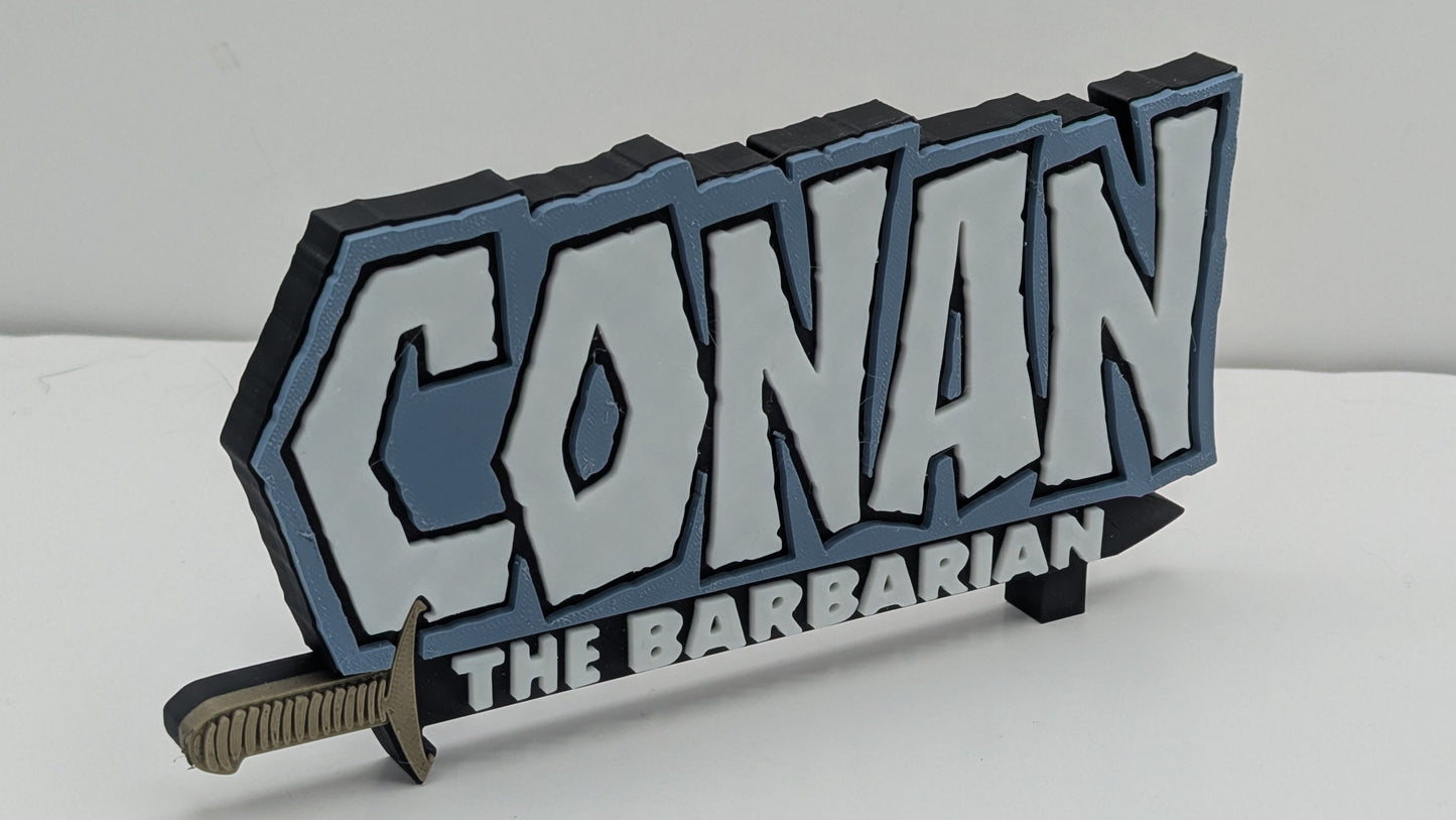 3D printed 'Conan the Barbarian' logo with a sword on a white background