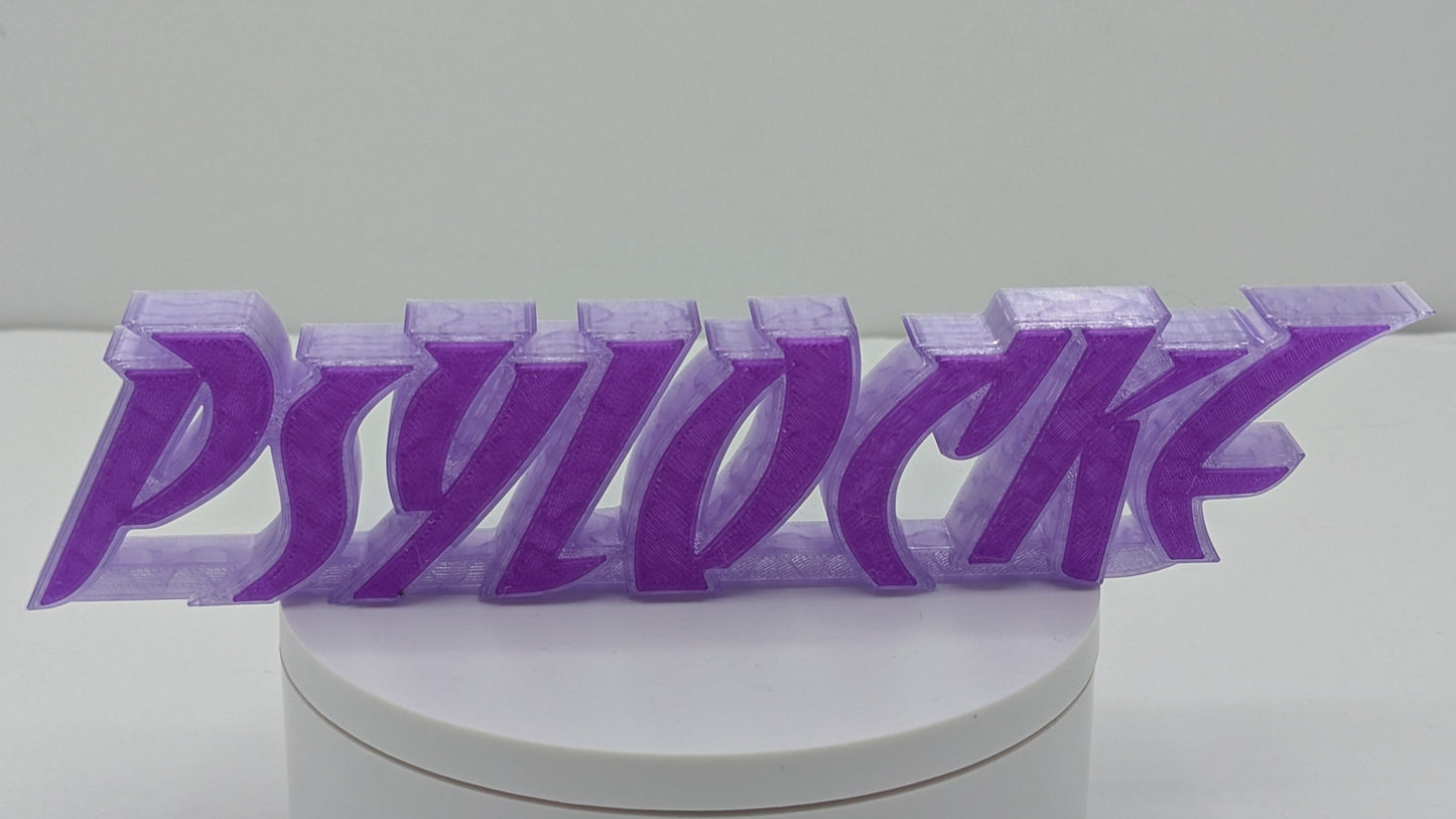 Purple 3D-printed 'Psylocke' text on a white circular base with a white background