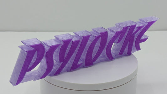3D-printed 'PSYLOCKE' logo on a white cylindrical base with a white background