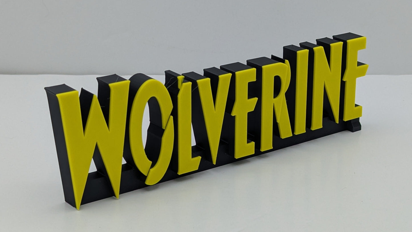 3D printed nameplate with 'WOLVERINE' in yellow on a black background
