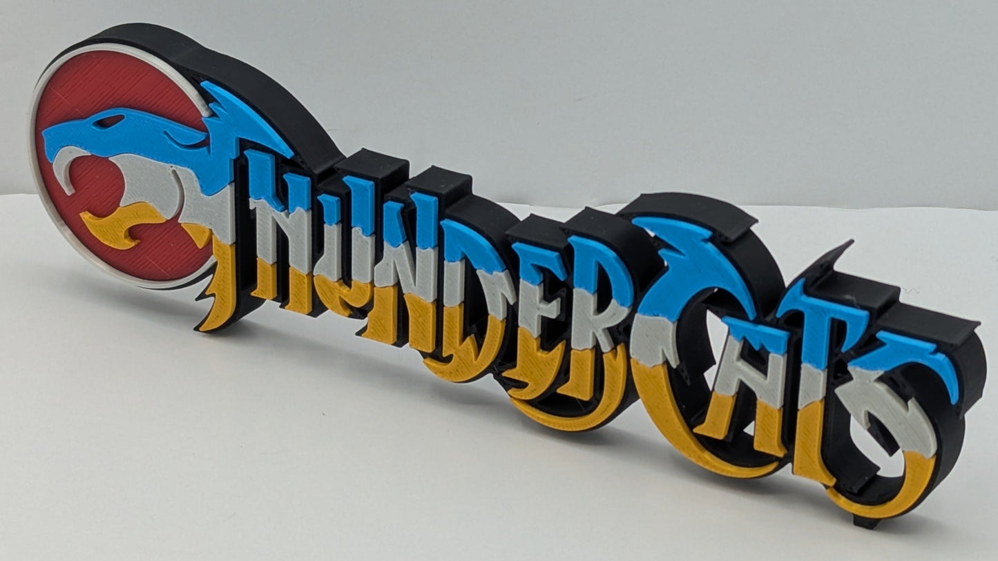 3D printed 'ThunderCats' logo on a white background