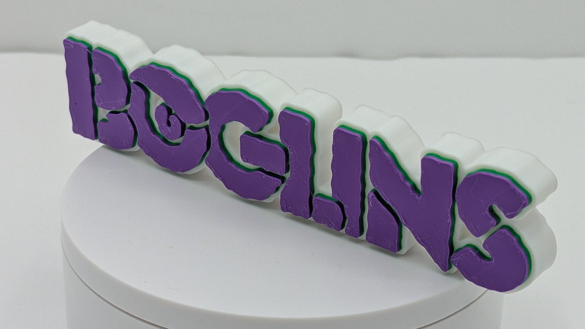 Decorative box with 'BOGLINS' text on a white background