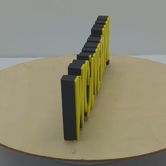 Wolverine X23 logo, yellow lettering on a black background