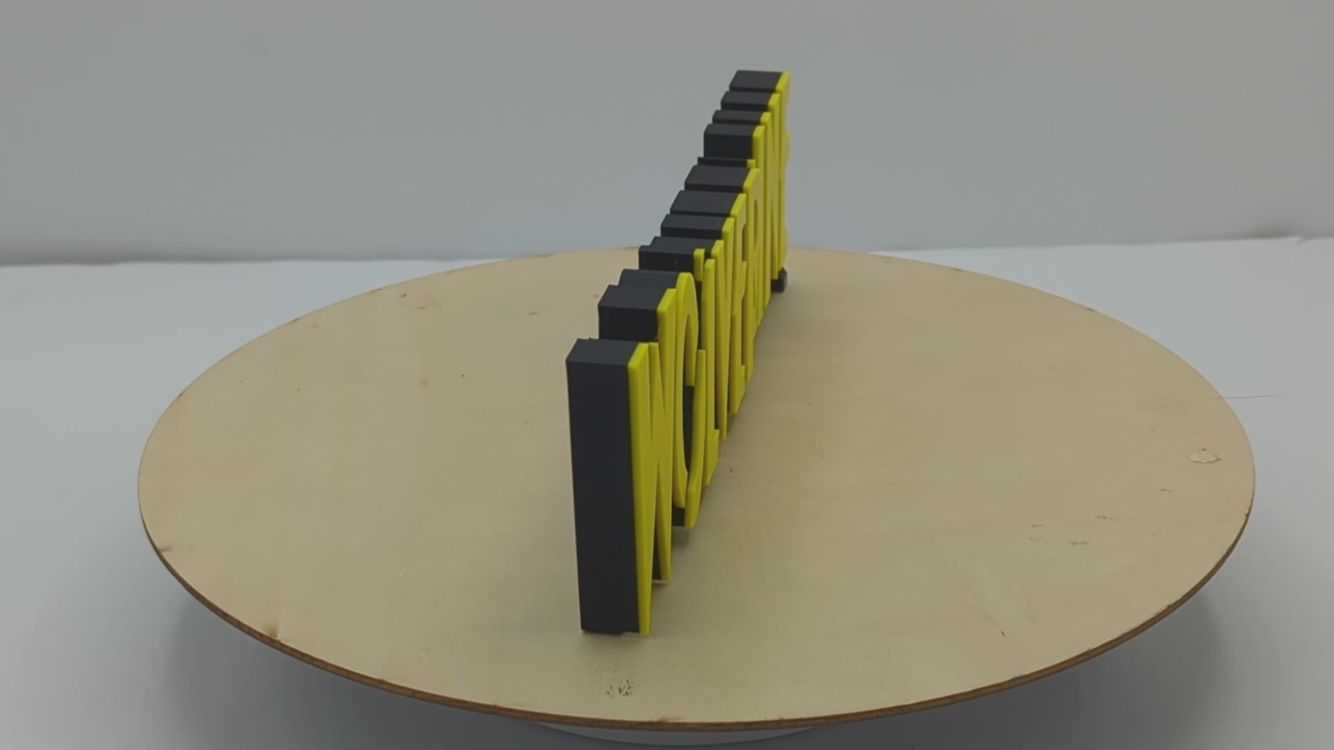 Wolverine X23 logo, yellow lettering on a black background