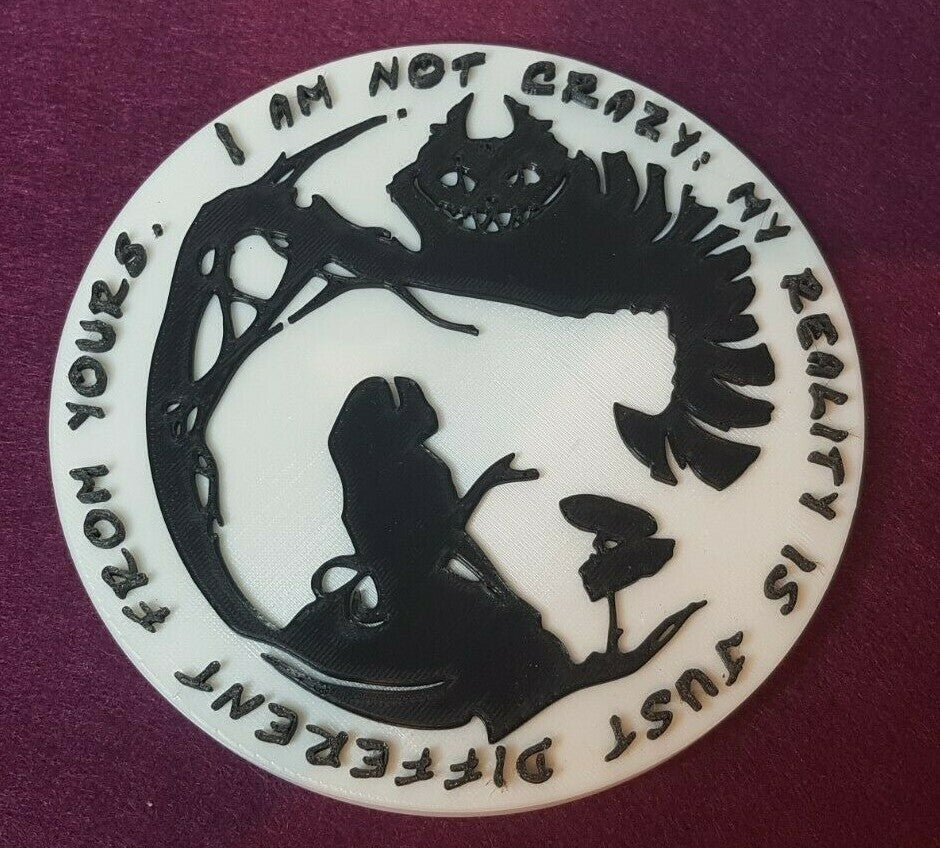 Alice meets the Cheshire cat. Silhouette wall plaque. 150mm diameter.